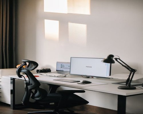 Ergonomic home office setup with desk lamp